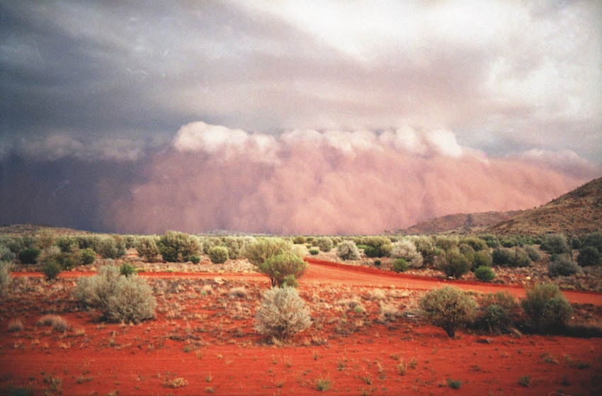 Fig. 12 Dust storm arriving at ten-year anniversary of Land Rights. Itjinpiri 1991. AI-0037663 Pitjantjatjara Council collection. Photo: Mike Last.