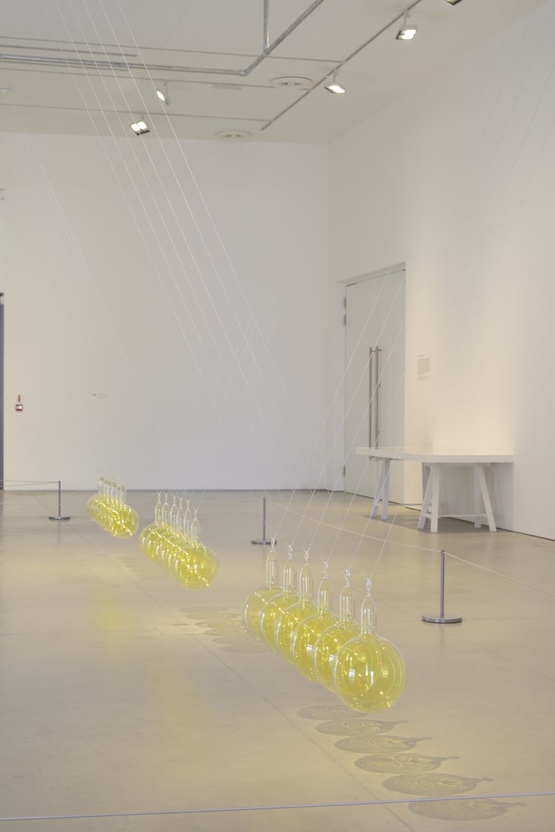 Hamad Butt, v (1994), vacuum- sealed glass, crystal iodine, liquid bromine, chlorine gas, water and steel. Image courtesy of the Tate Gallery.