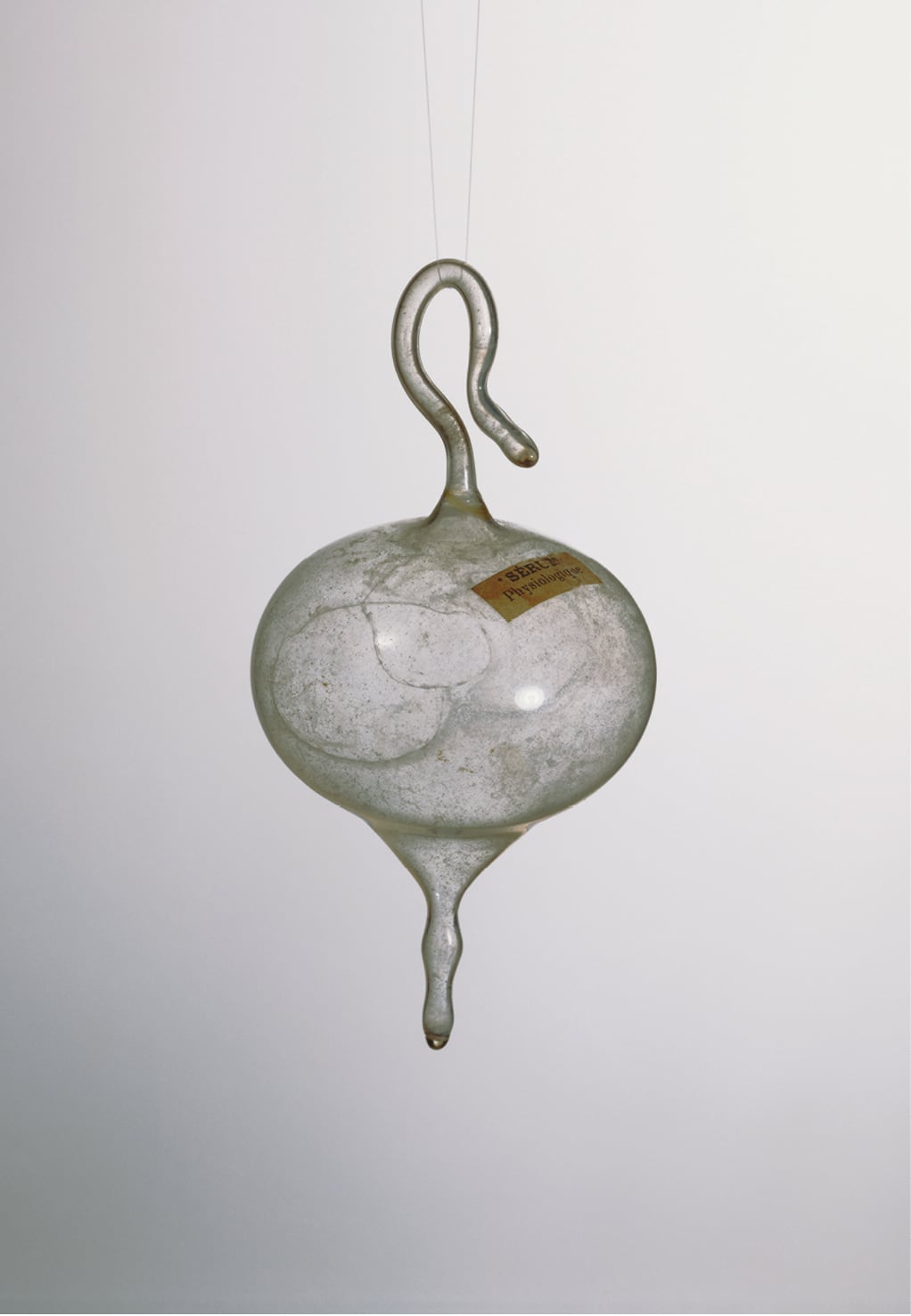Marcel Duchamp, <em>50 cc of Paris Air</em>, glass ampoule (broken and later restored), 1919. Height: 13.3 cm., The Louise and Walter Arensberg Collection, 1950. Image courtesy Philadelphia Museum of Art
