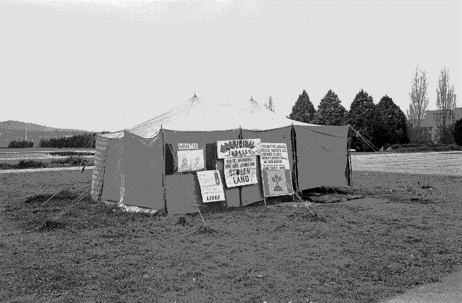 <em>‘You are living on stolen land’: the sign on the Aboriginal Tent Embassy, Canberra</em> 1974, National Archives of Australia: A7973, INT1205/8