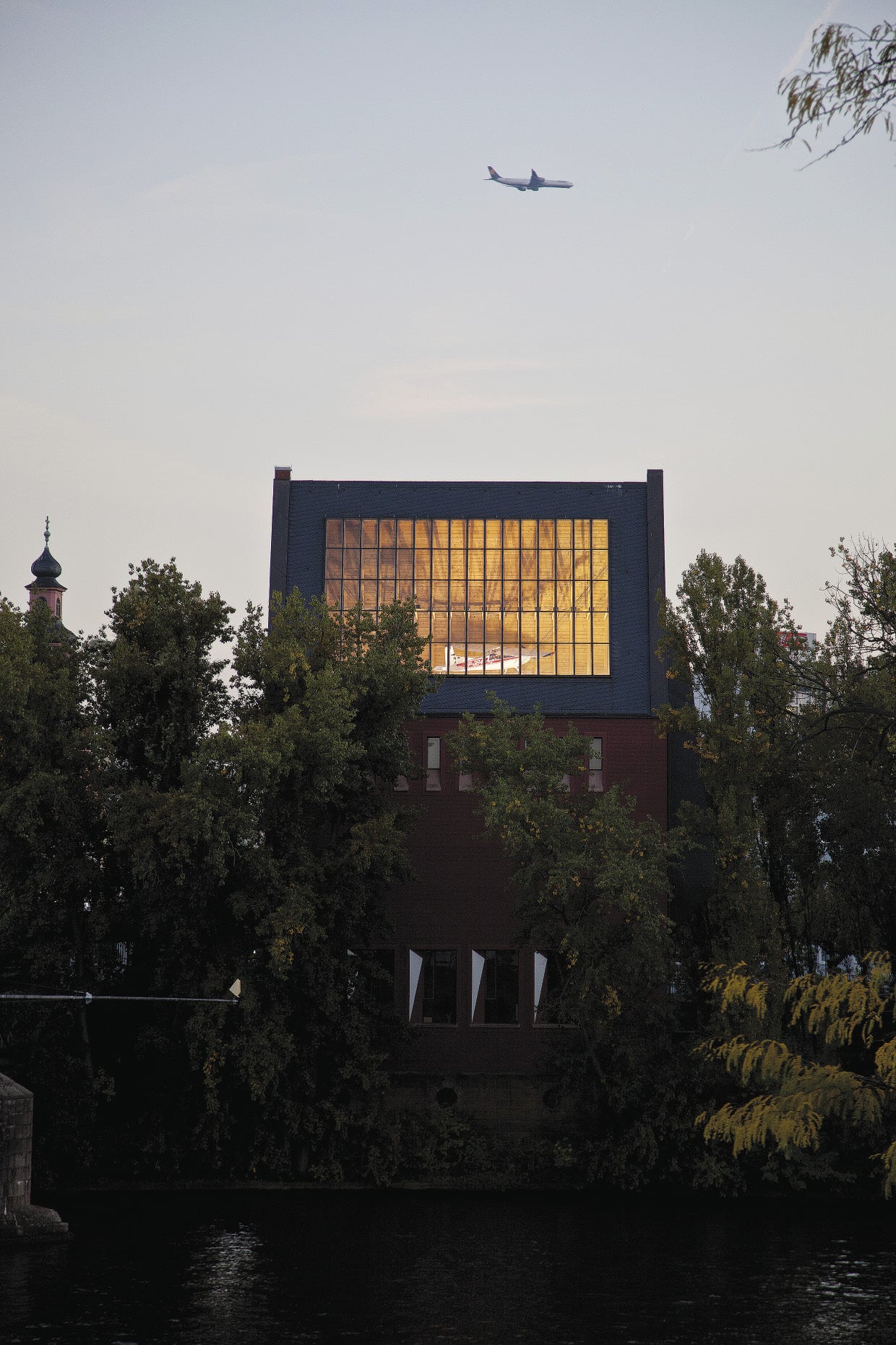 Michael Stevenson<br>A Life of Crudity, Vulgarity, and Blindness 2012<br>daylight, large-scale paper aircraft model, mirror, lens, buttermilk on plexiglas<br>installation at Portikus<br>Image courtesy the artist<br>Photo credit: Helena Schlichting