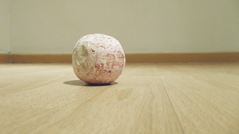Karmelo Bermejo  <br>−x 2012  <br>bank notes and glue<br>An undisclosed sum of false counterfeit banknotes, acquired with public money and moulded by hand by the Director of the Art Centre into a ball, which was later auctioned in order to be burnt by the highest bidder at a secret meeting later in the Director’s office.<br>Image courtesy the artist