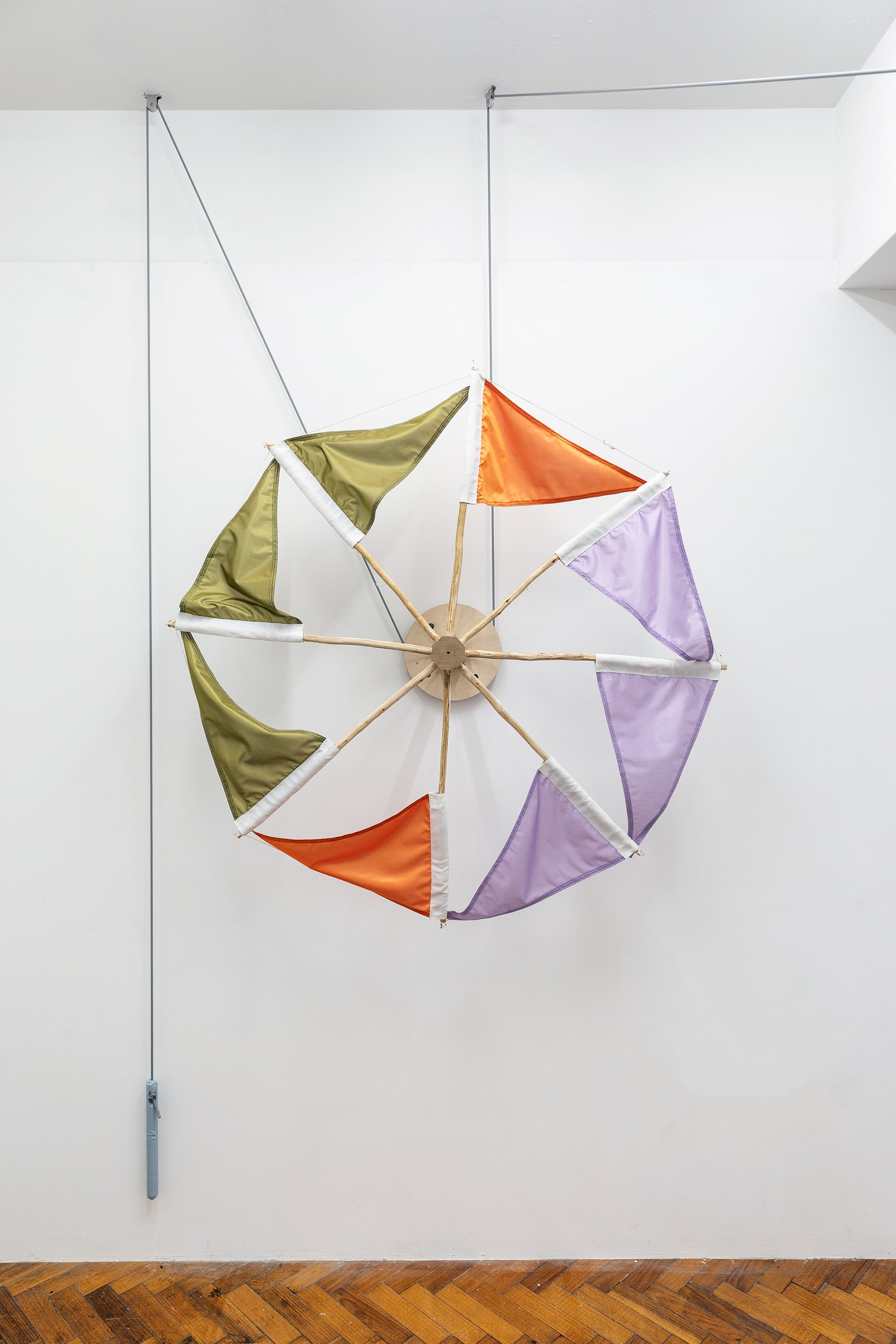 Image 02: Nadine Christensen, Signal Decoy (2018), synthetic and cotton printed fabric, sapling, plywood, cast iron, polycotton rope, aluminium pulley mechanismDimensions variable. Courtesy the artist and Sarah Scout Presents, Melbourne. Photography: Andrew Curtis.