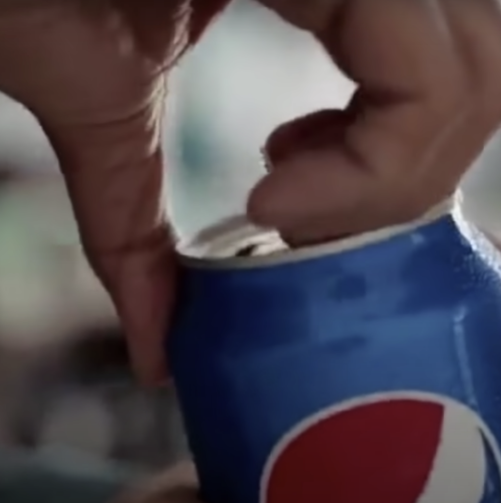 A can of Pepsi being opened